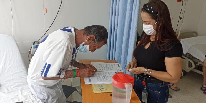 Luis Meneses gets his compensation letter in Ibague's Nuestra Clinic